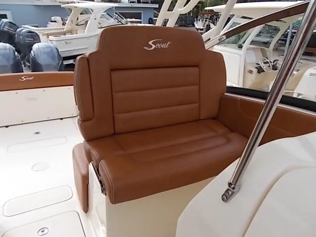 Slide: The Image of 2025 Scout 255 Dorado boat with brown leather seating. - 13