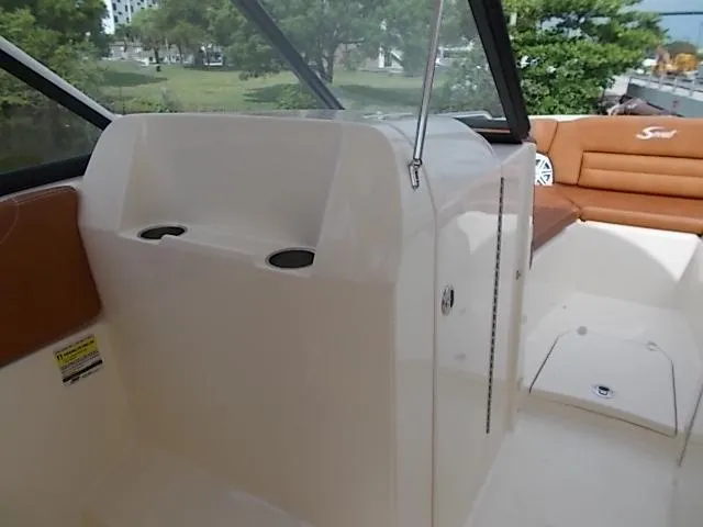 Slide: The Image of 2025 Scout 255 Dorado boat interior with seating and storage compartments. - 9