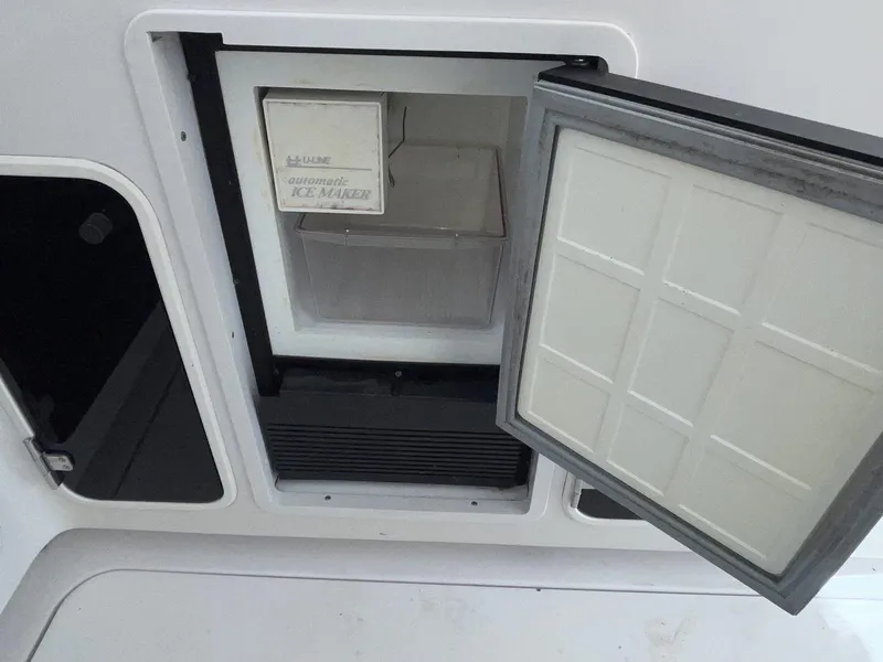 Slide: The Image of Built-in ice maker on a 1992 Four Winns 365 Express boat. - 10
