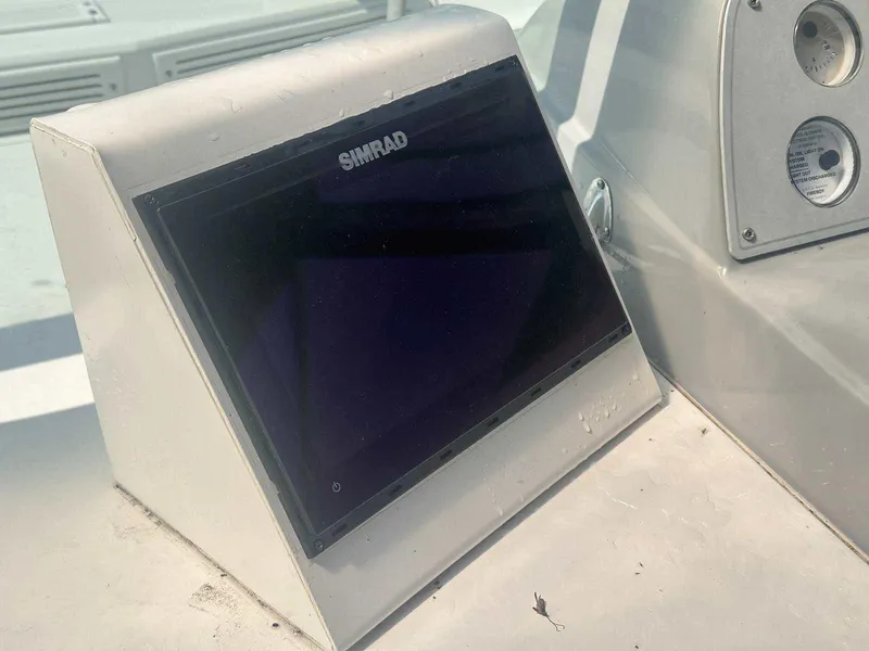 Slide: The Image of Simrad display on 1992 Four Winns 365 Express boat dashboard. - 14