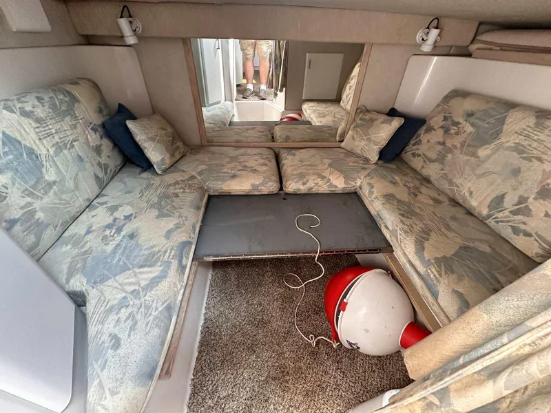 Slide: The Image of Interior of 1992 Four Winns 365 Express boat with patterned seating and carpet. - 16