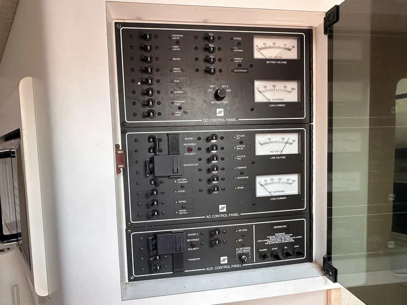 Slide: The Image of Electrical control panel on a 1992 Four Winns 365 Express boat. - 18