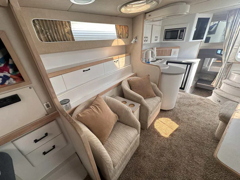 Slide: The Image of Luxurious interior of 1992 Four Winns 365 Express yacht with cozy seating and modern amenities. - 19