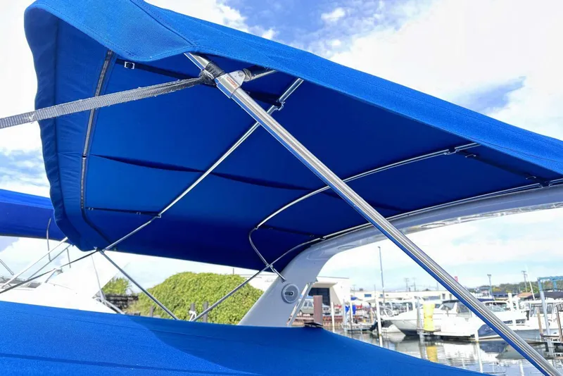Slide: The Image of Blue canopy on 1992 Four Winns 365 Express boat at marina. - 2