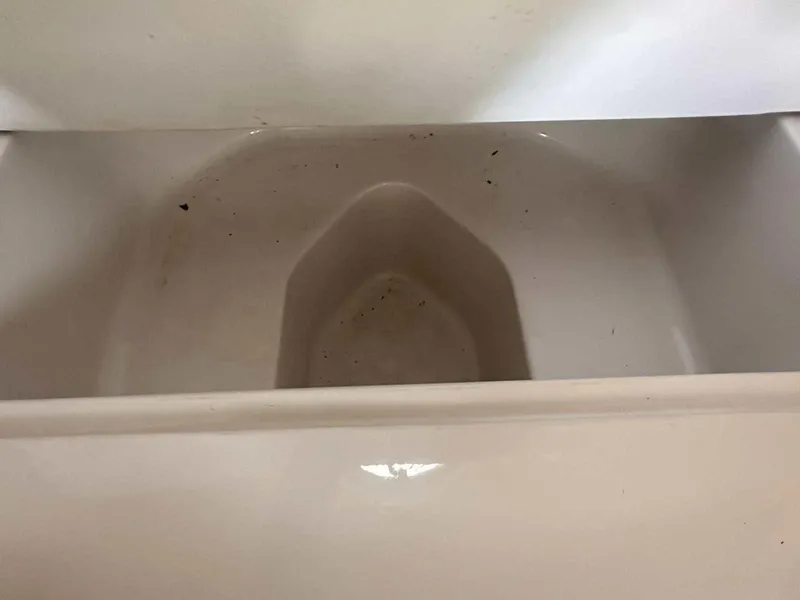 Slide: The Image of Interior compartment of 1992 Four Winns 365 Express boat, showing storage space. - 24