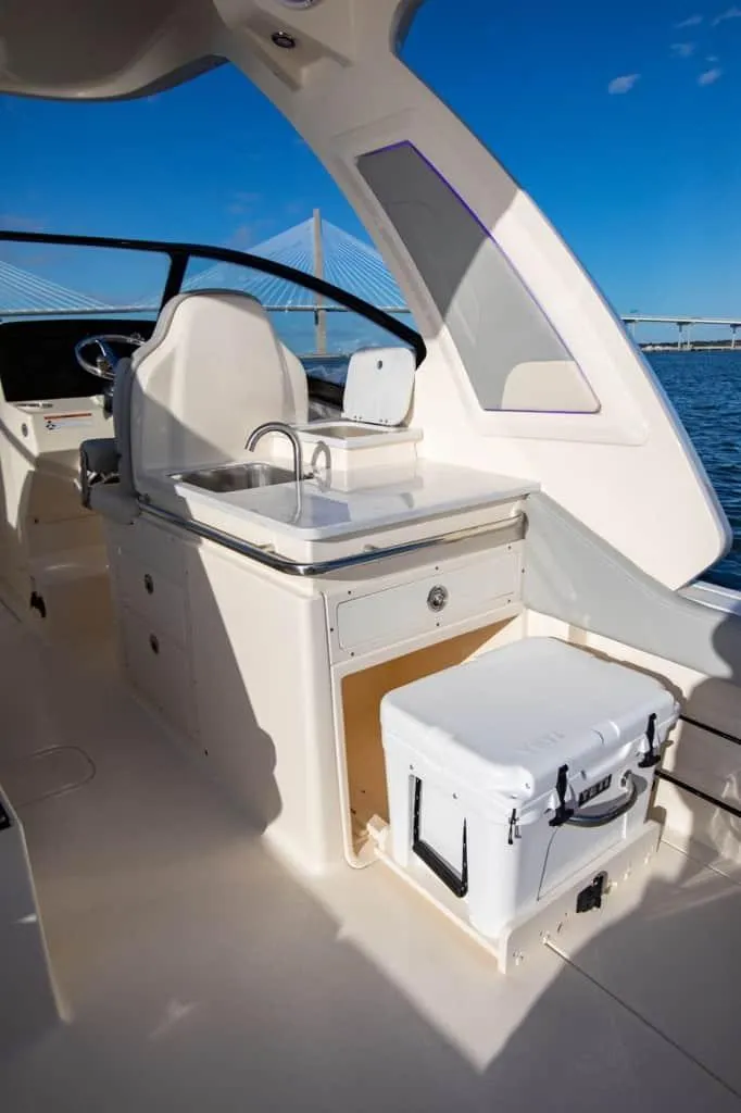 Slide: The Image of 2025 Scout 277 Dorado boat interior with sink and cooler. - 4