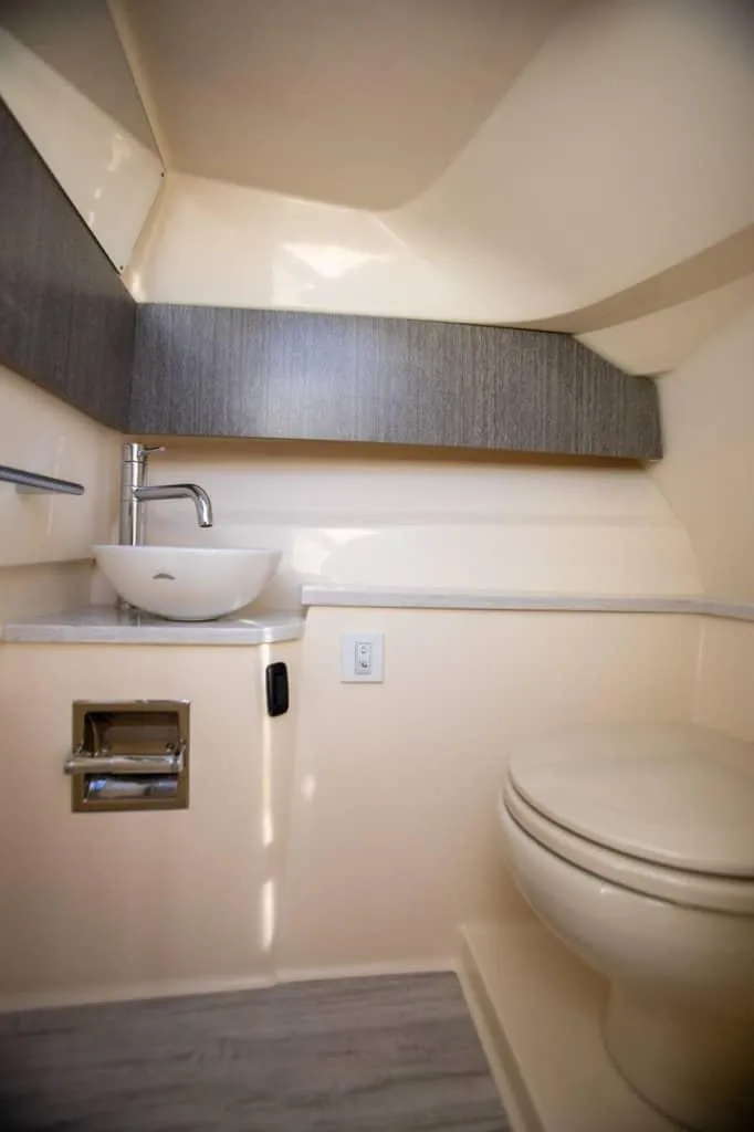 Slide: The Image of 2025 Scout 277 Dorado boat bathroom with modern sink and toilet. - 5