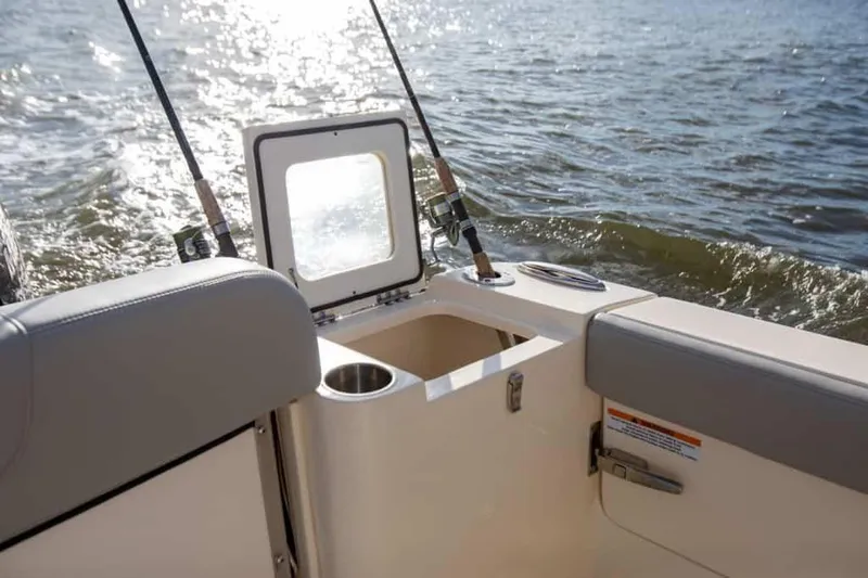Slide: The Image of 2025 Scout 277 Dorado boat interior with fishing rods and ocean view. - 7