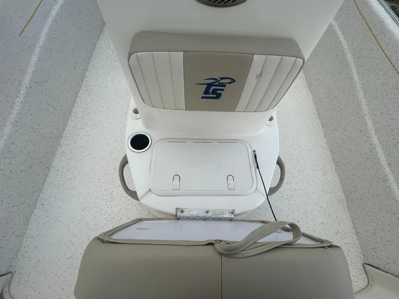 Slide: The Image of 2019 Carolina Skiff 198 DLV boat interior with seating and storage compartment. - 13