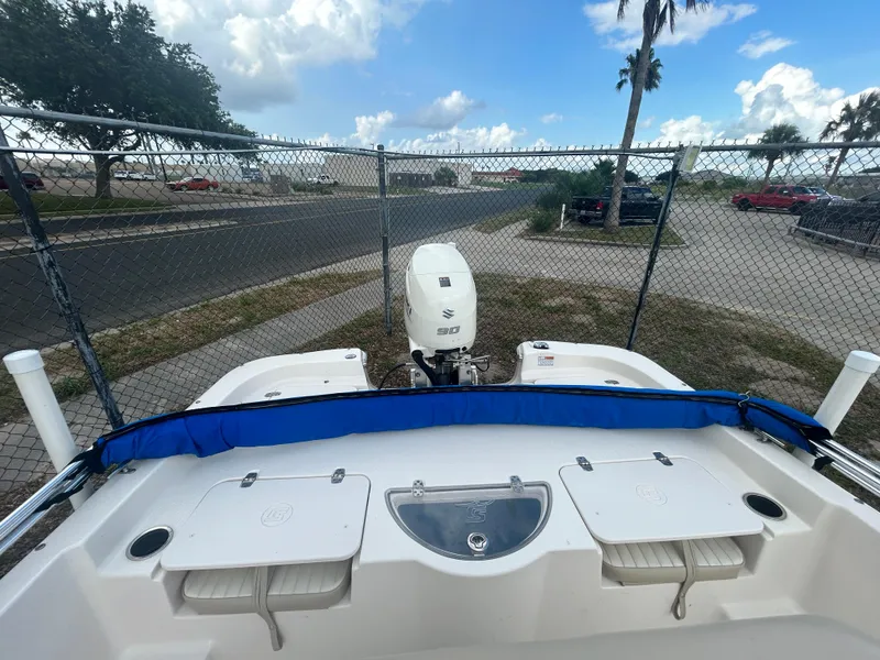 Slide: The Image of 2019 Carolina Skiff 198 DLV boat with Suzuki outboard motor, rear view. - 5