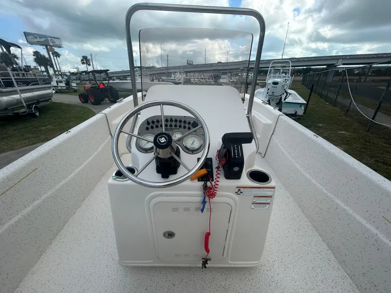 Slide: The Image of 2019 Carolina Skiff 198 DLV boat console with steering wheel and controls. - 7