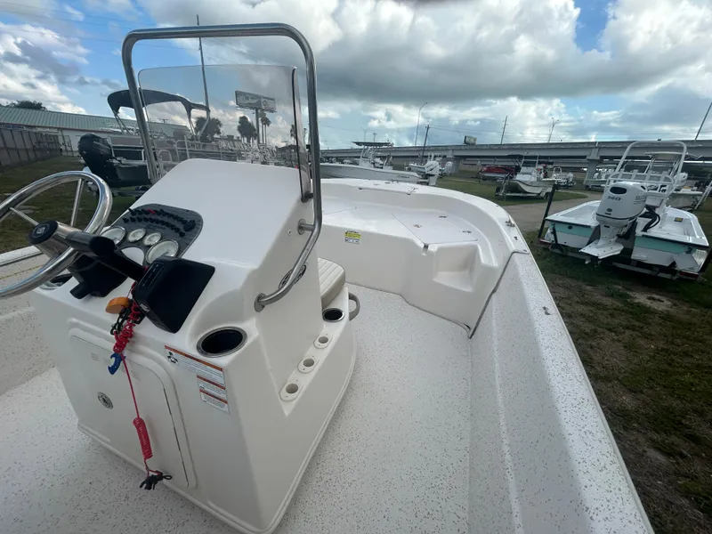 Slide: The Image of 2019 Carolina Skiff 198 DLV boat with center console and steering wheel. - 8