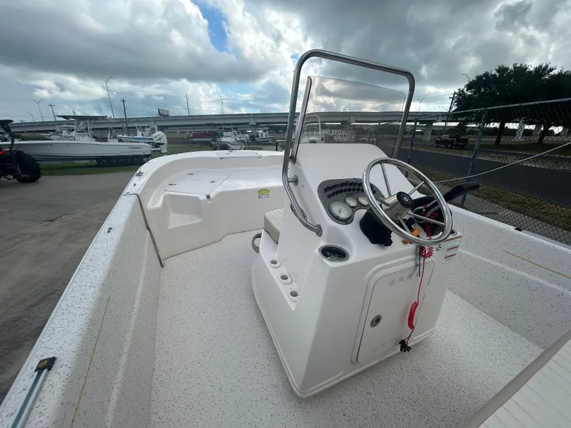 Slide: The Image of 2019 Carolina Skiff 198 DLV boat interior with steering console and open deck. - 9