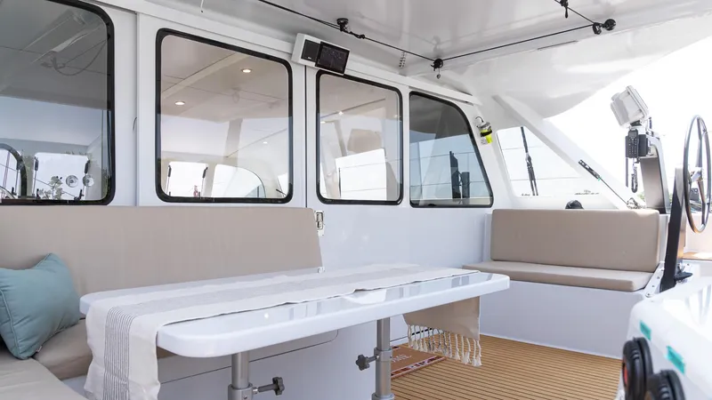 Slide: The Image of Spacious interior of 2022 Custom Current Marine 46 yacht with seating and table. - 10
