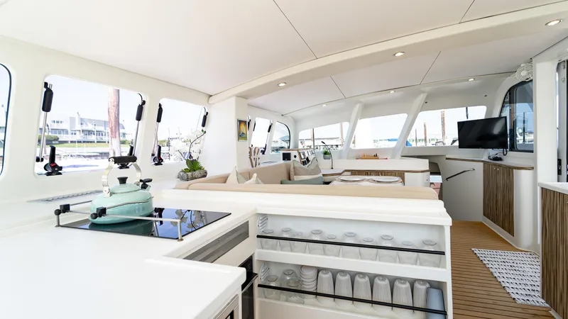 Slide: The Image of Luxurious interior of 2022 Custom Current Marine 46 yacht with modern kitchen and seating area. - 19