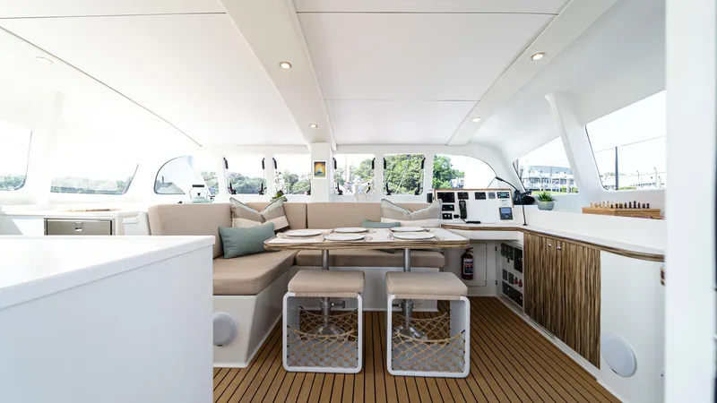 Slide: The Image of Luxurious interior of 2022 Custom Current Marine 46 yacht with modern seating and dining area. - 21