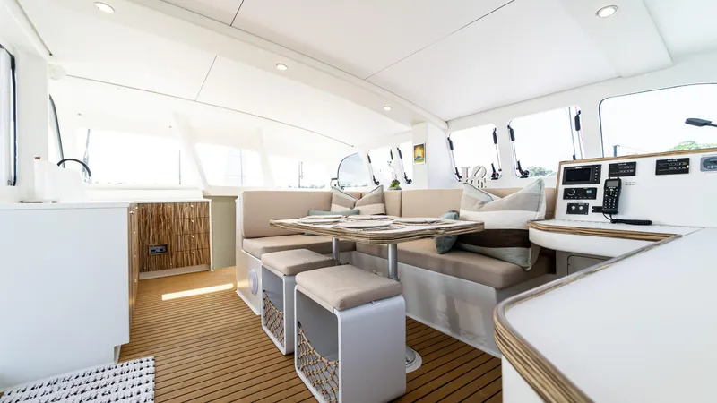 Slide: The Image of Luxurious interior of 2022 Custom Current Marine 46 yacht with modern seating and wood flooring. - 22