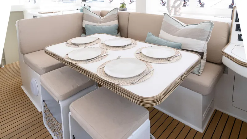 Slide: The Image of Luxurious dining area on 2022 Custom Current Marine 46 yacht with elegant table setting. - 23