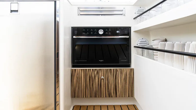 Slide: The Image of Modern kitchen area in 2022 Custom Current Marine 46 yacht. - 27