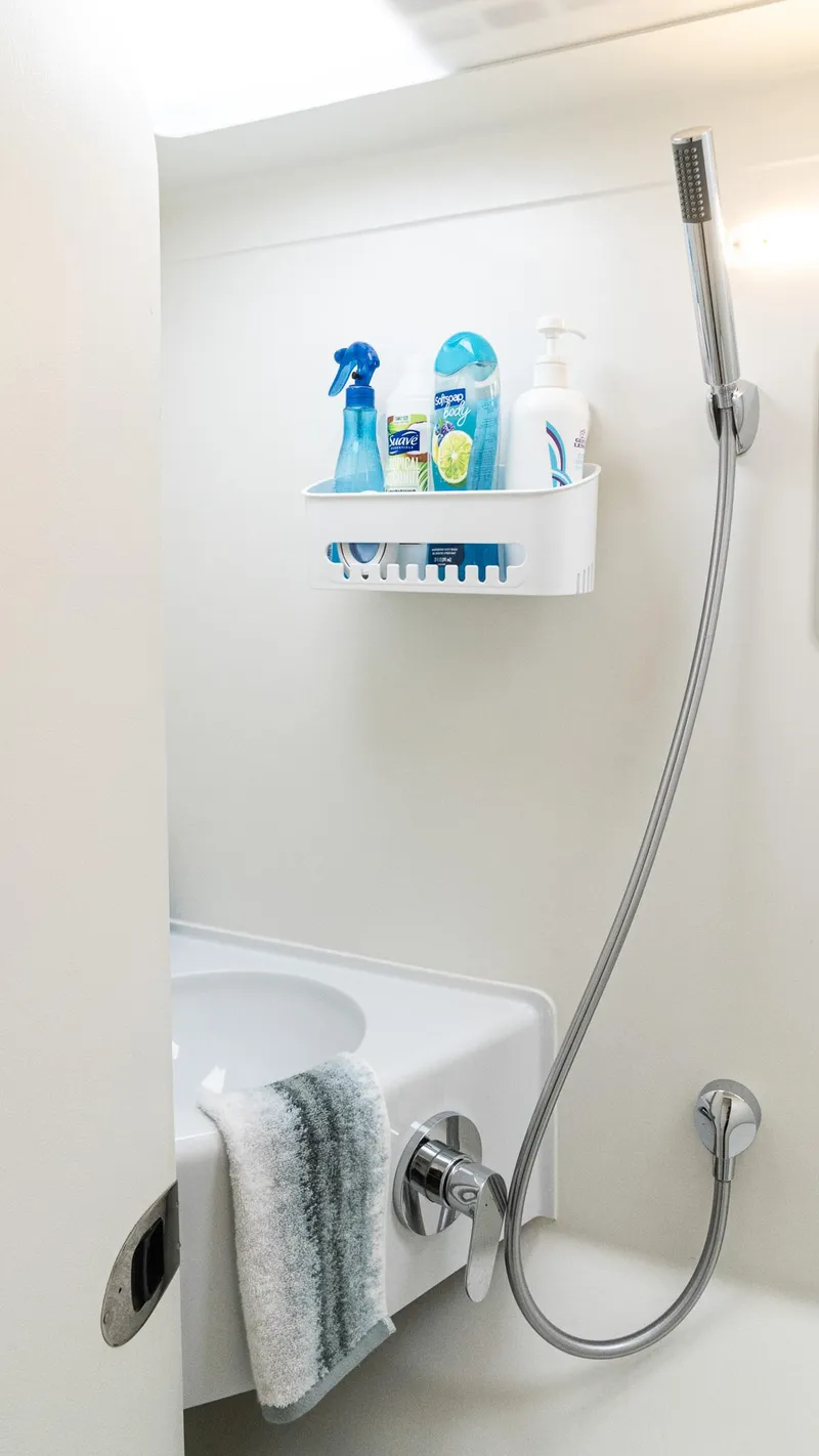 Slide: The Image of Modern bathroom in 2022 Custom Current Marine 46 yacht with shower and toiletries. - 32