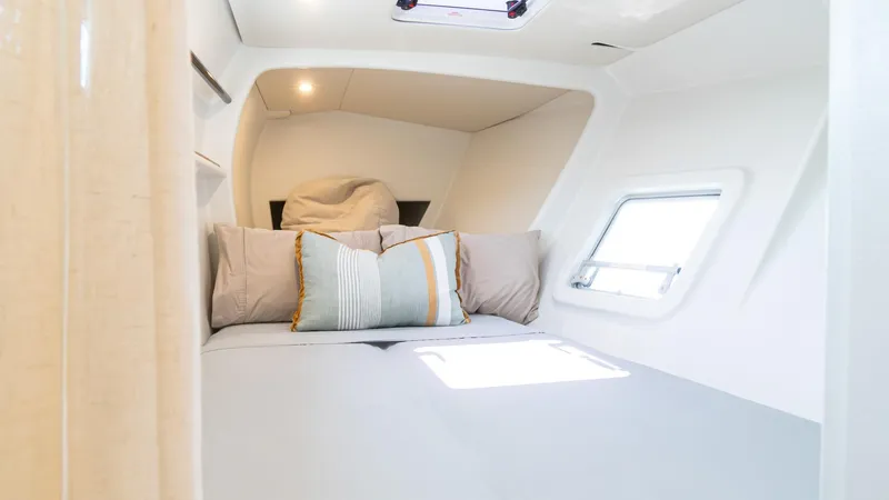 Slide: The Image of Cozy cabin interior of 2022 Custom Current Marine 46 yacht with modern bedding. - 35