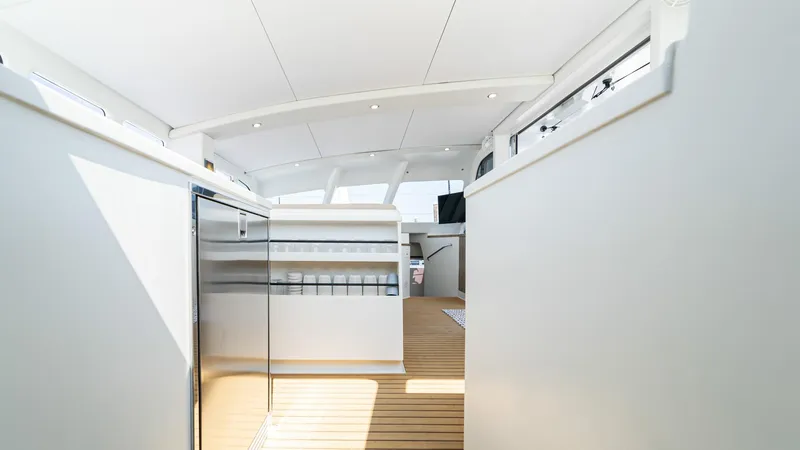 Slide: The Image of Interior of 2022 Custom Current Marine 46 yacht with modern design and wooden flooring. - 37