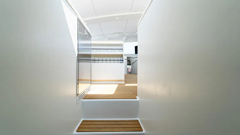 Slide: The Image of Interior of 2022 Custom Current Marine 46 yacht with sleek, modern design and wooden flooring. - 38