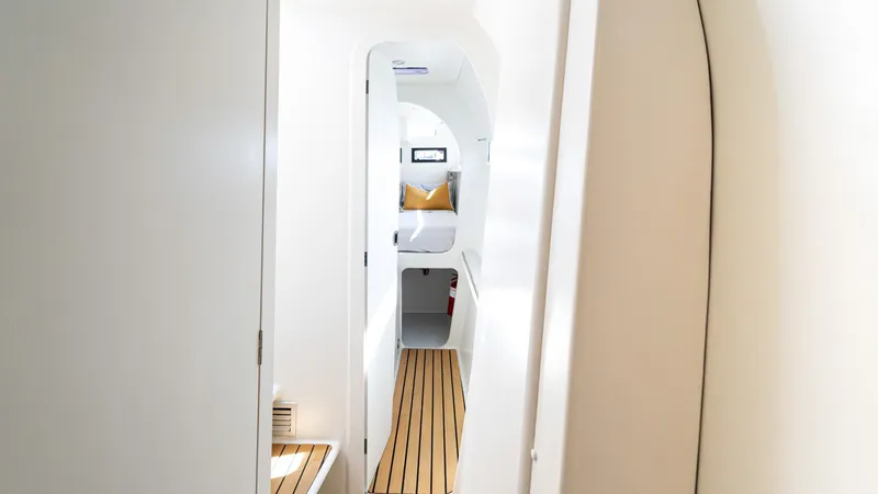 Slide: The Image of Interior of 2022 Custom Current Marine 46 yacht with sleek design and wooden flooring. - 40