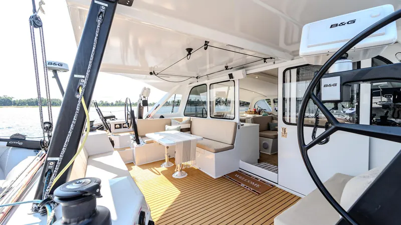 Slide: The Image of Luxurious 2022 Custom Current Marine 46 yacht interior with modern seating and navigation equipment. - 5