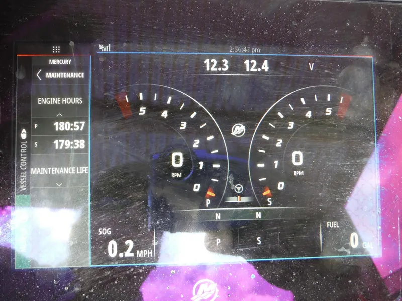 Slide: The Image of Digital dashboard of a 1999 Baja 29 Outlaw boat showing maintenance and engine data. - 19