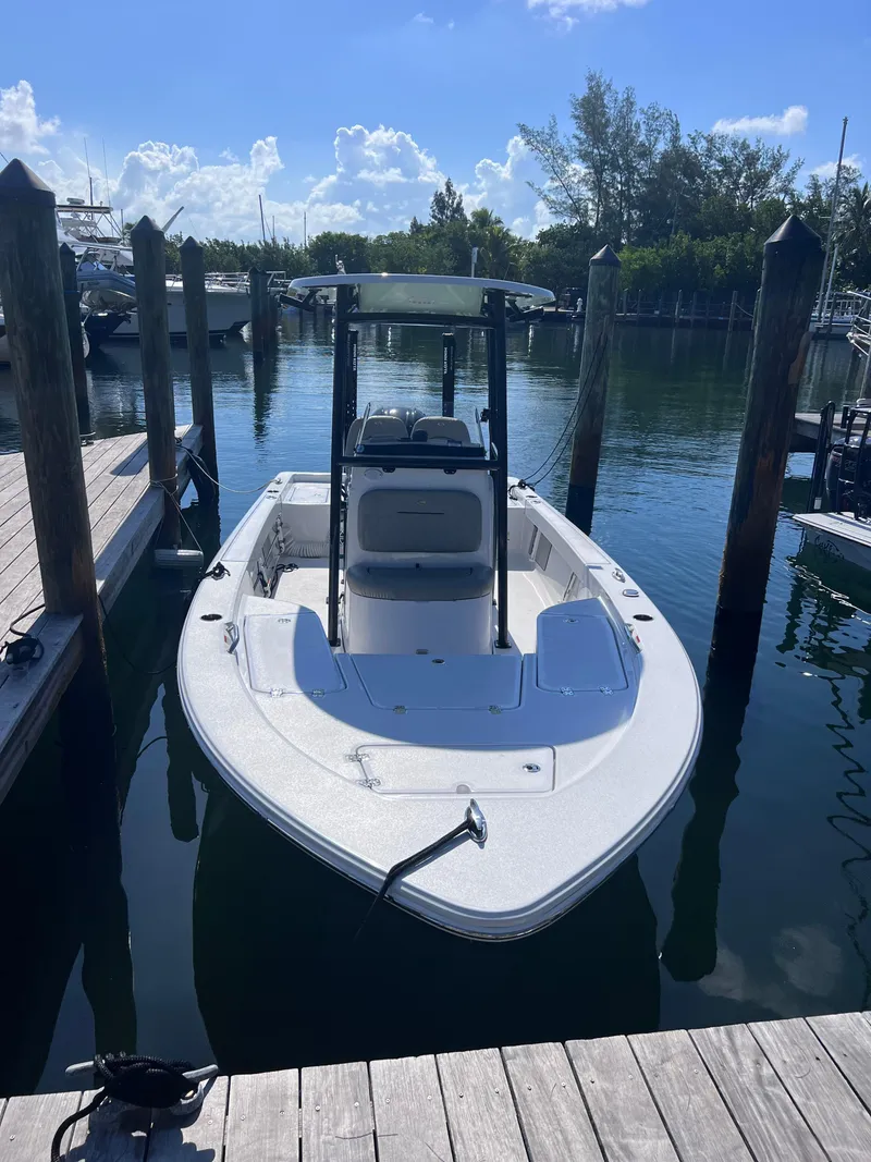 Slide: The Image of 2022 Sportsman Masters 227 Bay Boat docked in a marina. - 3