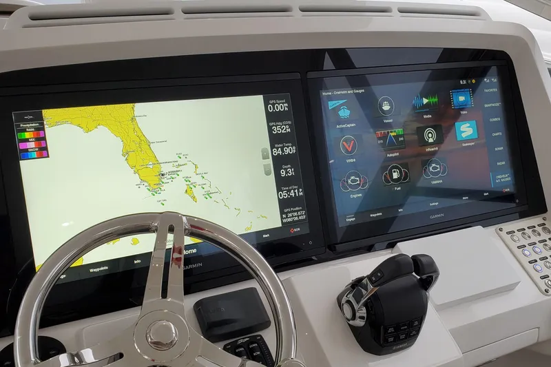 Slide: The Image of Control panel of 2019 Intrepid 475 Sport Yacht with navigation and system displays. - 24