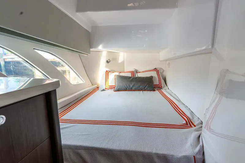 Slide: The Image of Luxurious cabin interior of 2019 Intrepid 475 Sport Yacht with modern bedding and sleek design. - 47