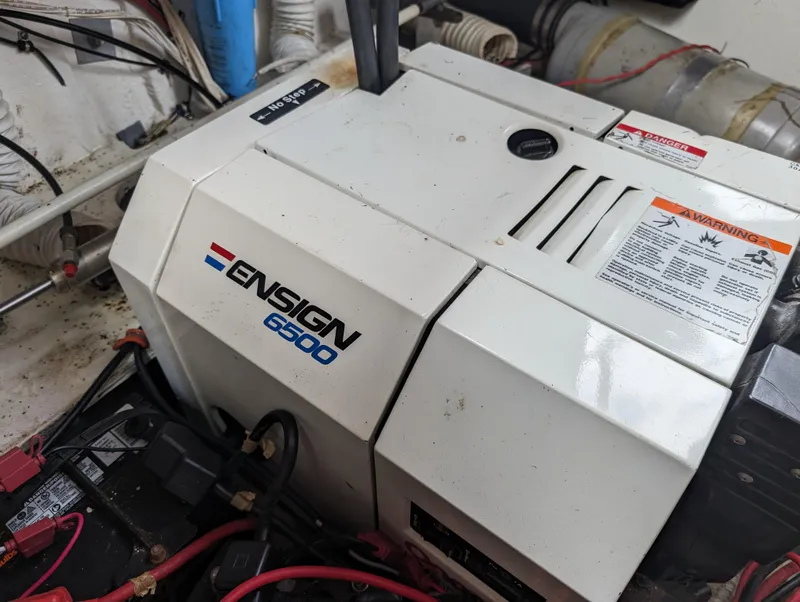 Slide: The Image of 1987 Cruisers 3370 Esprit engine compartment with Ensign 6500 generator. - 12