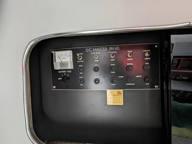 Slide: The Image of 1987 Cruisers 3370 Esprit DC master panel with battery test and control switches. - 17