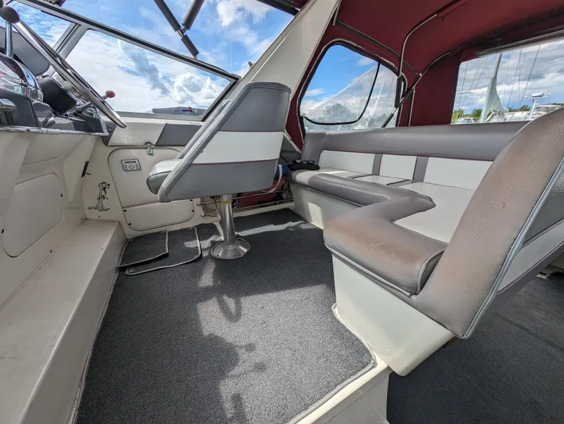 Slide: The Image of 1987 Cruisers 3370 Esprit boat interior with helm seat and passenger seating. - 6