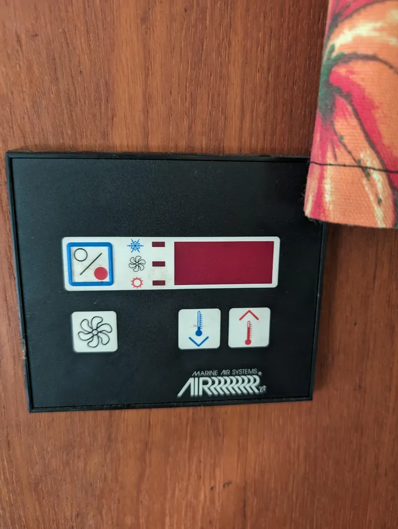 Slide: The Image of Cruisers 3370 Esprit 1987 boat control panel with temperature and fan settings. - 11