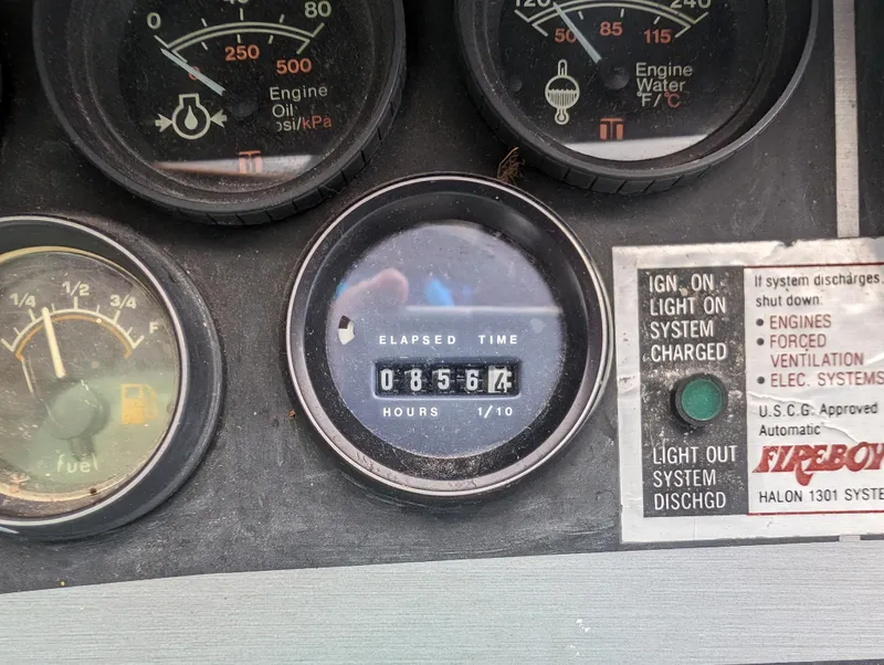 Slide: The Image of 1987 Cruisers 3370 Esprit dashboard with elapsed time gauge and engine indicators. - 15