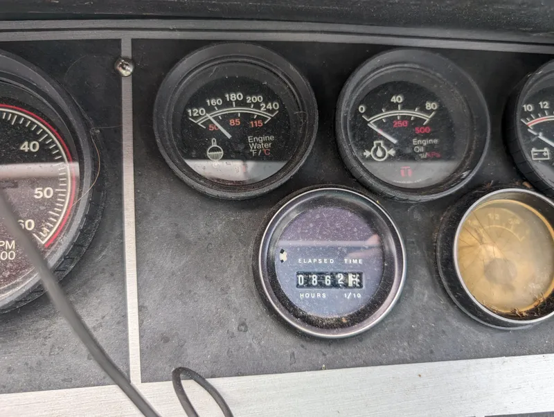 Slide: The Image of Close-up of 1987 Cruisers 3370 Esprit boat dashboard gauges. - 16