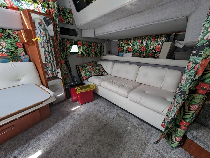 Slide: The Image of Interior of 1987 Cruisers 3370 Esprit with floral curtains and white sofa. - 8