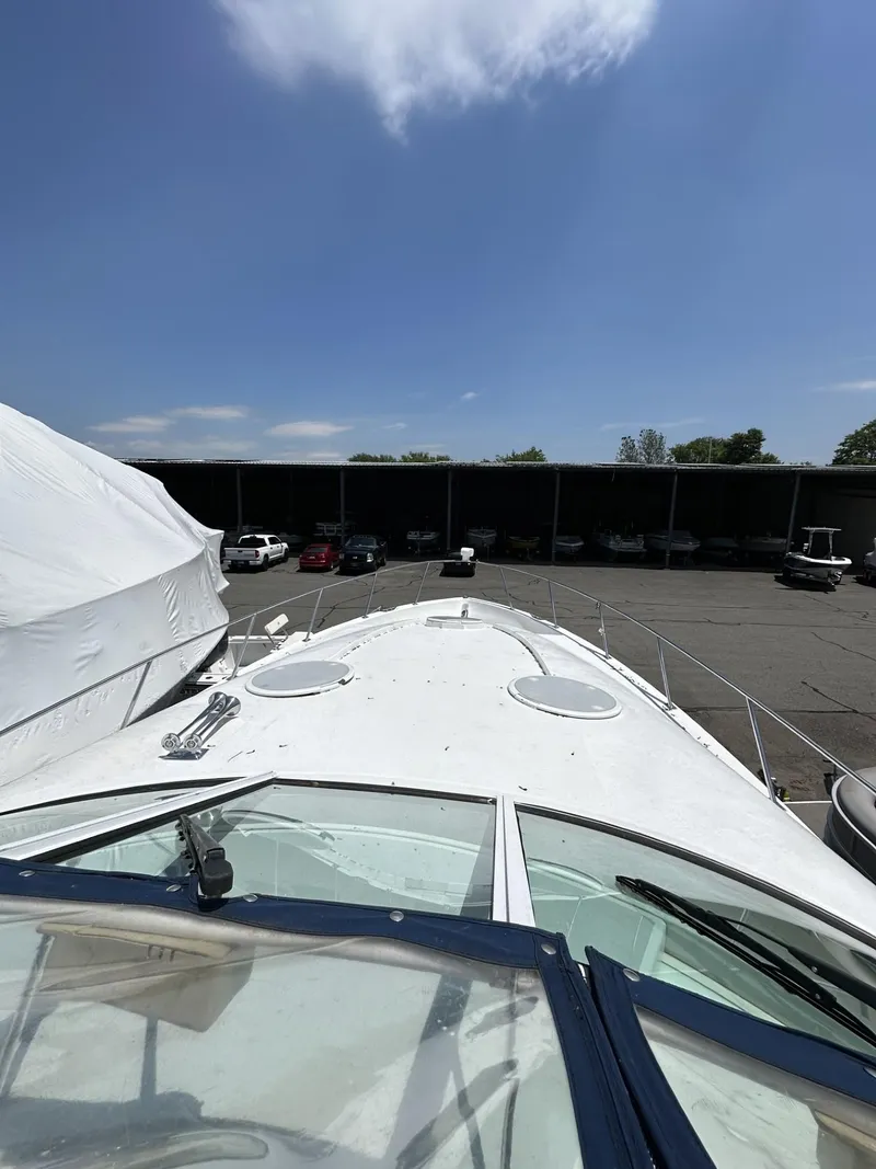 Slide: The Image of 1997 Chris-Craft 380 Continental B yacht docked in a marina. - 11