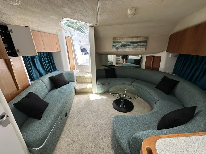 Slide: The Image of Luxurious interior of 1997 Chris-Craft 380 Continental B yacht with curved seating and modern decor. - 17