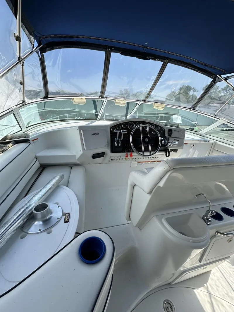 Slide: The Image of 1997 Chris-Craft 380 Continental B boat cockpit with steering wheel and controls. - 7