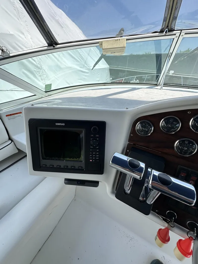 Slide: The Image of 1997 Chris-Craft 380 Continental B helm with navigation system and control panel. - 8