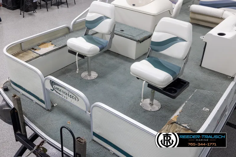 Slide: The Image of 2002 Suncruiser Trinidad 224 pontoon boat interior with two swivel seats. - 10