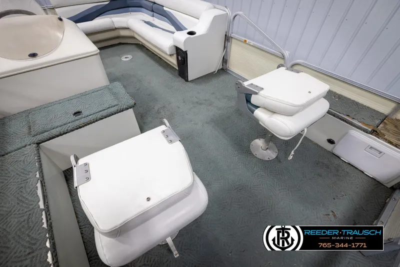 Slide: The Image of 2002 Suncruiser Trinidad 224 boat interior with seating and fishing chairs. - 20