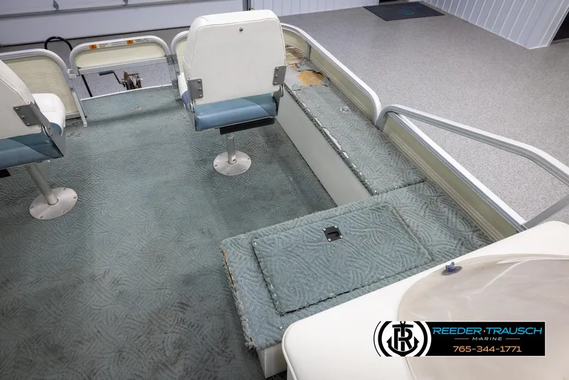 Slide: The Image of 2002 Suncruiser Trinidad 224 boat interior with seating and storage compartments. - 23