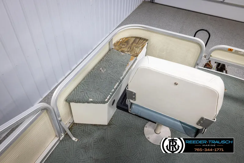 Slide: The Image of 2002 Suncruiser Trinidad 224 boat interior with seating and storage compartments. - 25