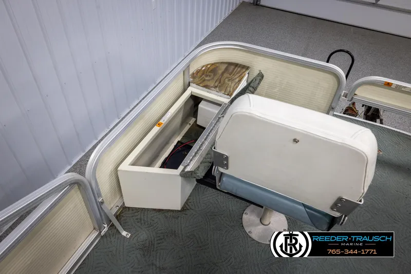 Slide: The Image of 2002 Suncruiser Trinidad 224 boat interior with storage compartment and seating. - 26