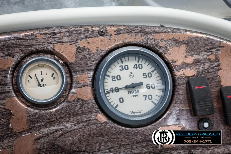 Slide: The Image of Close-up of 2002 Suncruiser Trinidad 224 boat dashboard with fuel and RPM gauges. - 31